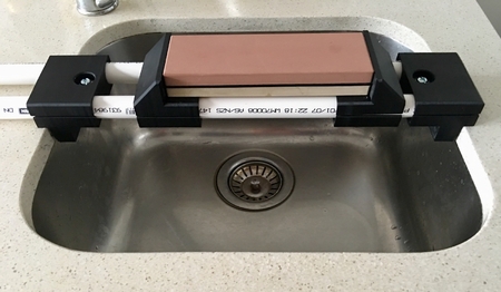 Sharpening stone sink bridge