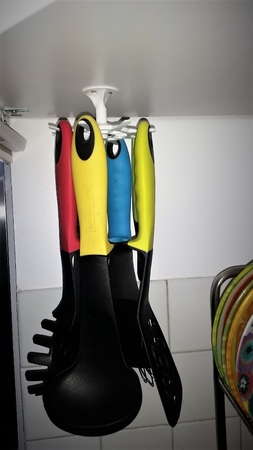 Suspended spatula holder